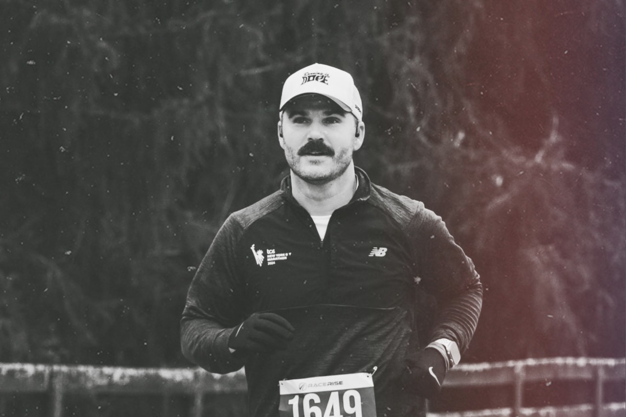 Black-and-white portrait of Drew Carter running